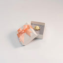 Papier-Ringbox mit Rosé Schleife